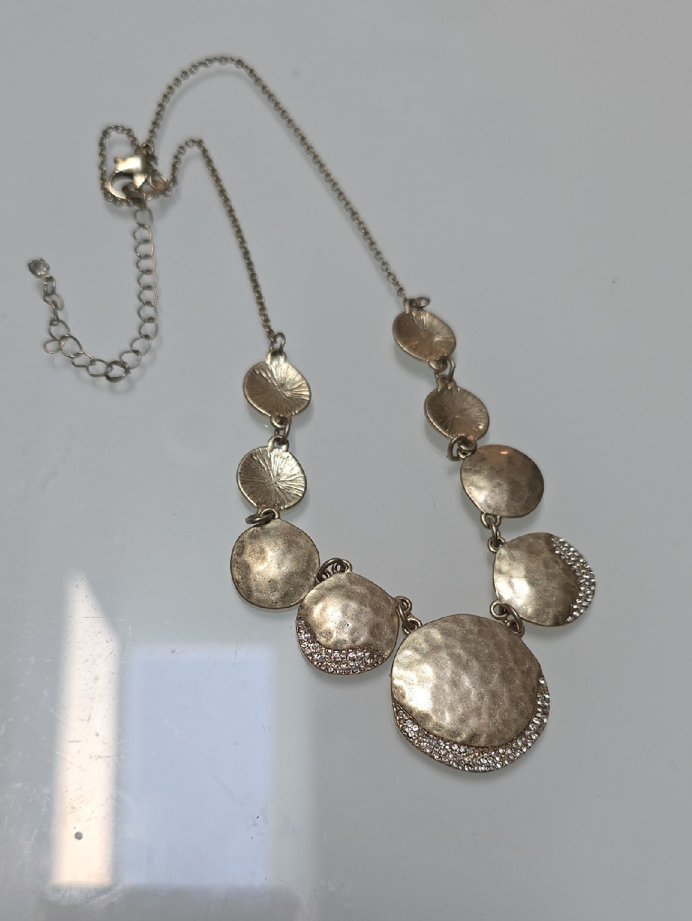 Gold Tone Hammered Disc Statement Necklace with Crystal Accents